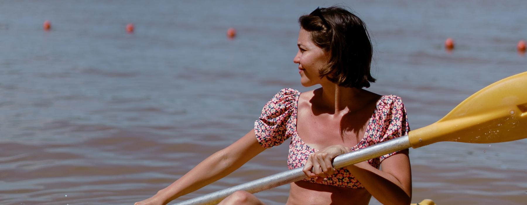 a person on a yellow raft in the water